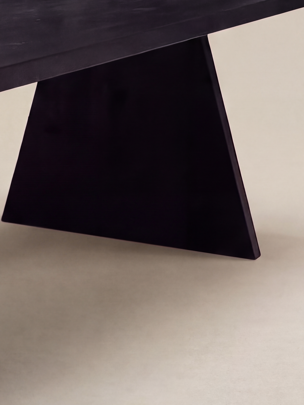 Prism Dining Table — shadowed triangular panel