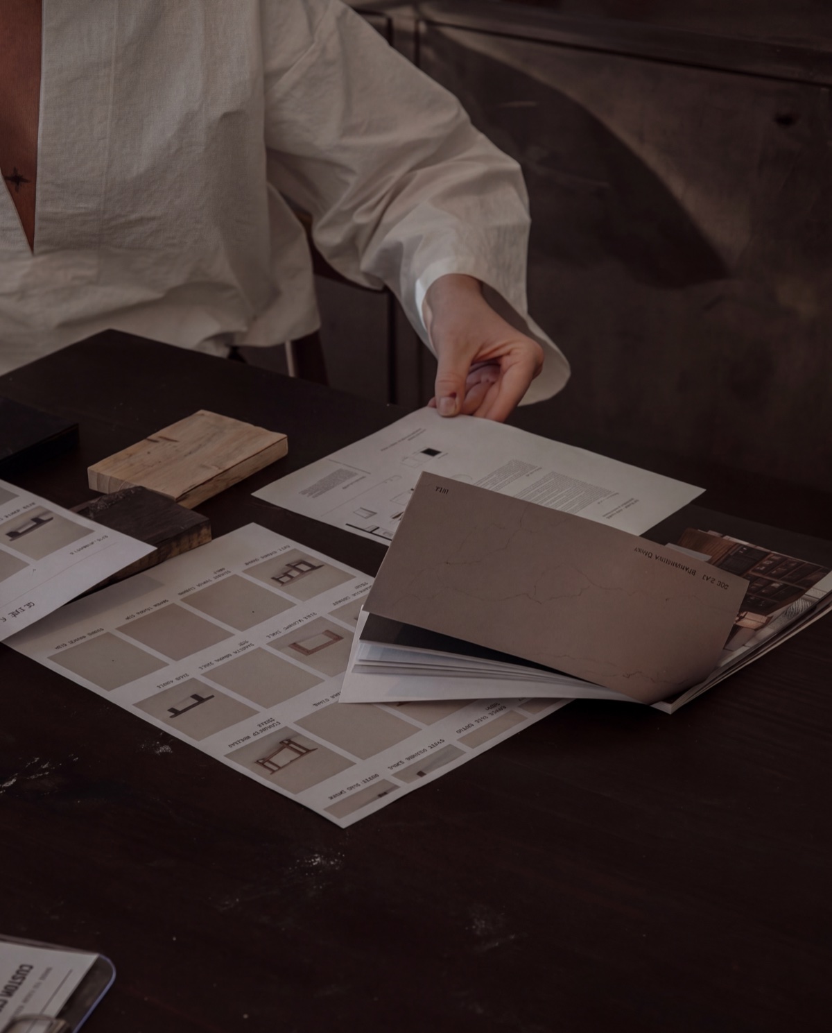 Comparing timber samples and furniture designs to choose a custom piece